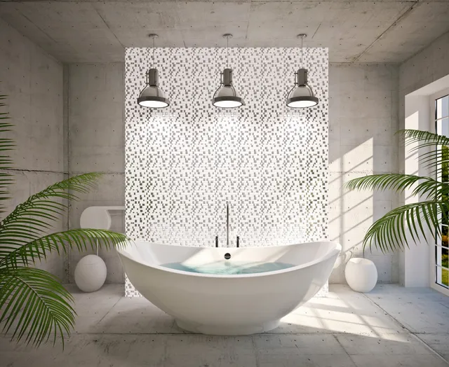 Modern bathroom with a freestanding oval bathtub and three pendant lights.